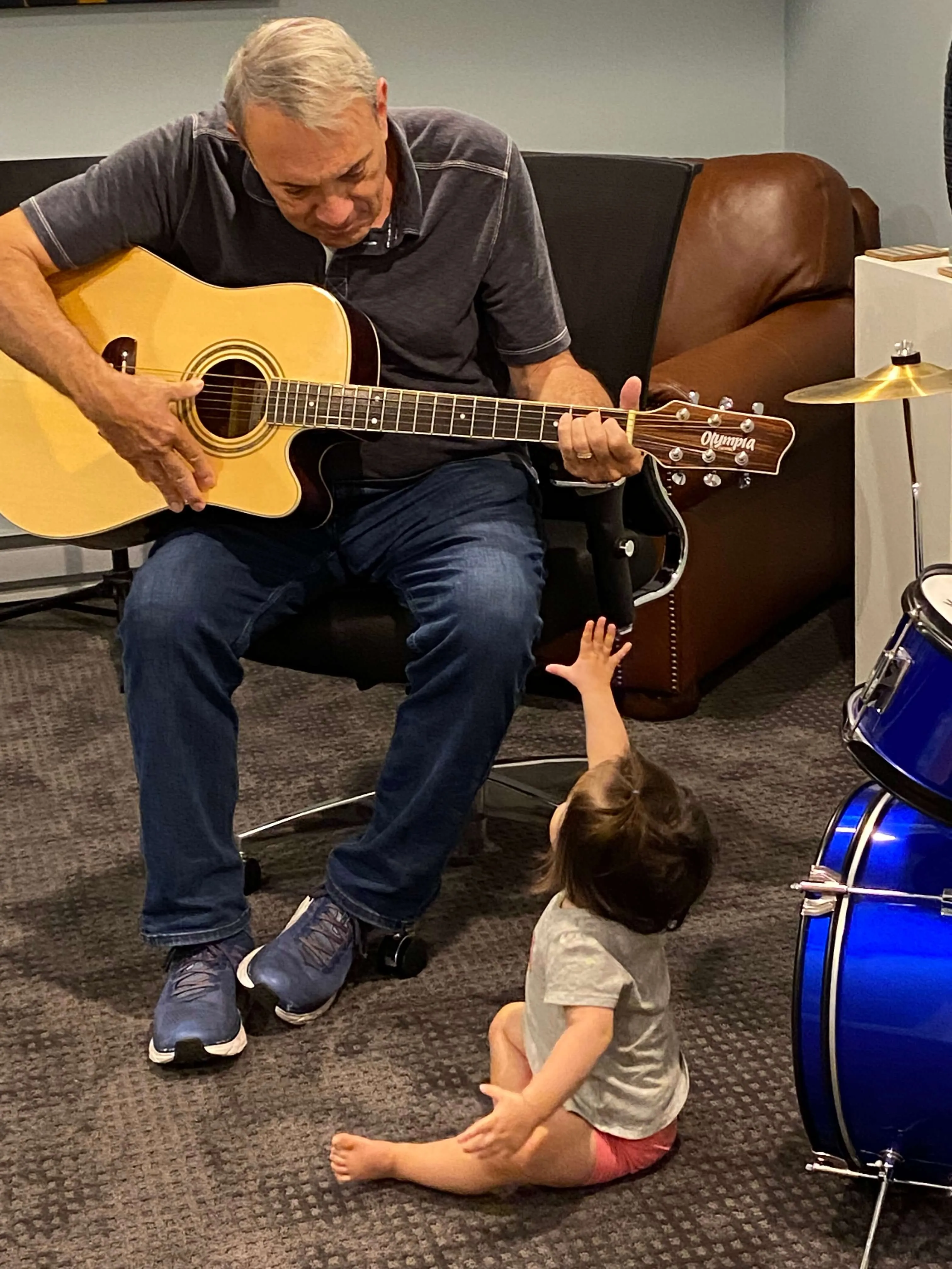 Paul Guarino with children and music
