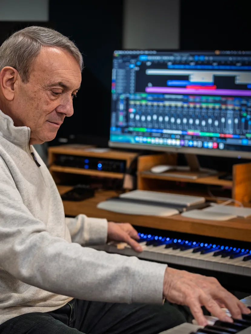 Paul Guarino composing at his keyboard